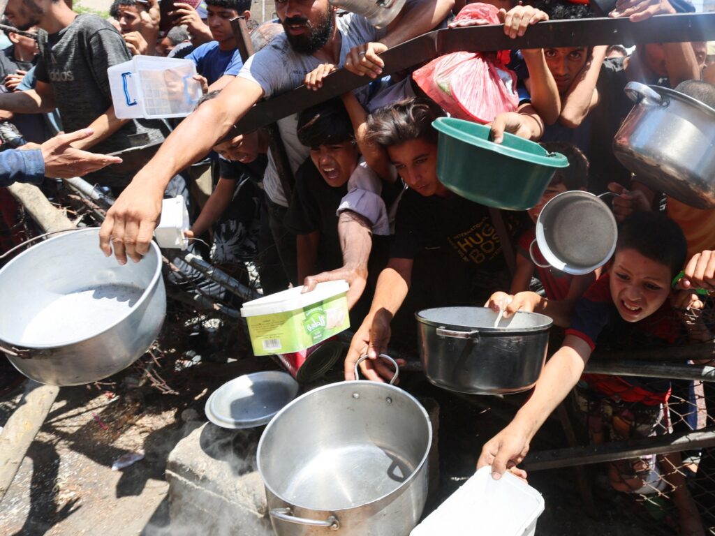 Israeli fire mows down starving Palestinians in Gaza as hunger deaths surge Israeli fire mows down starving Palestinians in Gaza as hunger deaths surge