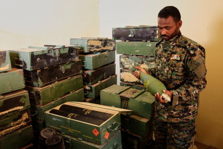 Sudanese army officers inspect a recently discovered weapons storage site belonging to the paramilitary Rapid Support Forces (RSF) in Khartoum, Sudan, Saturday, May 3, 2025. (AP Photo)