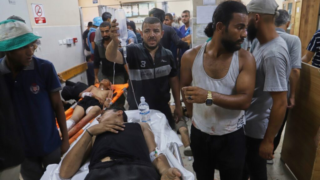 Charities and humanitarian groups press for end to Israeli-backed aid group in Gaza Charities and humanitarian groups press for end to Israeli-backed aid group in Gaza