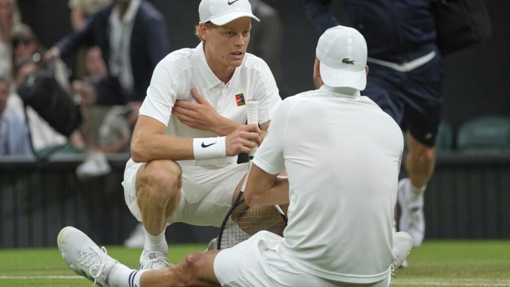 Jannik Sinner reaches the Wimbledon quarterfinals despite a bad elbow when an injured Dimitrov stops Jannik Sinner reaches the Wimbledon quarterfinals despite a bad elbow when an injured Dimitrov stops