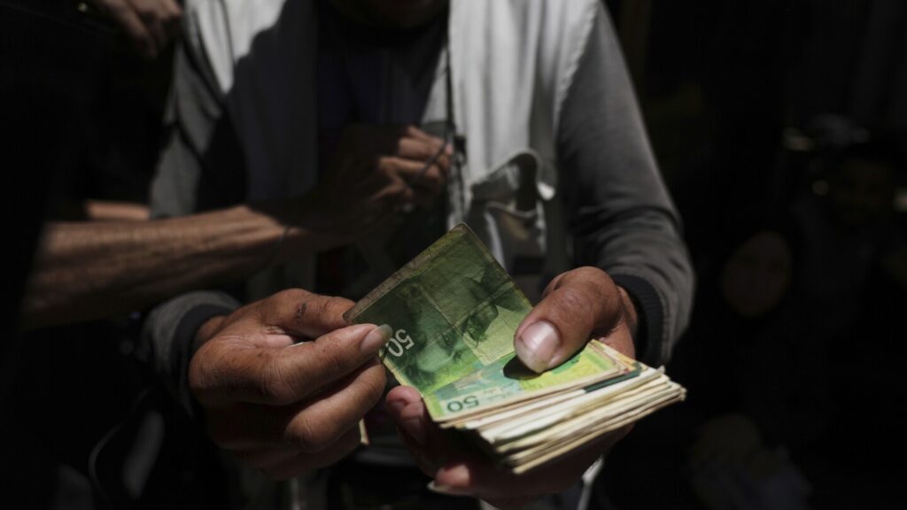 To get their own cash, people in Gaza must pay middlemen a 40% cut To get their own cash, people in Gaza must pay middlemen a 40% cut