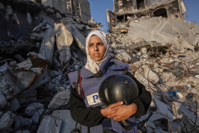 Freelance journalist Mariam Dagga, 33, who had been working with the Associated Press and other outlets during the Gaza war, poses for a portrait in Khan Younis, southern Gaza Strip, on June 14, 2024. Dagga was one of several journalists killed along with other people in Israeli strikes on Nasser Hospital in Khan Younis on Monday, Aug. 25, 2025. (AP Photo/Jehad Alshrafi)