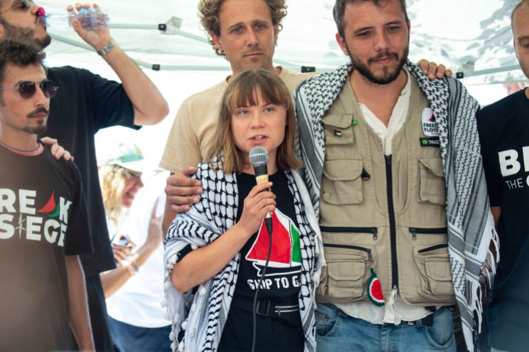 Climate activist Greta Thunberg flanked by Thiago Avila from a human rights organization meets with journalists in Catania, Italy, Sunday, June 1, 2025, ahead of their departure for the Mideast. (AP Photo/Salvatore Cavalli)