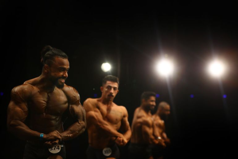 Competitors take part in the Men's Classic Physique competition during Dubai Muscle Beach at Mall of the Emirates