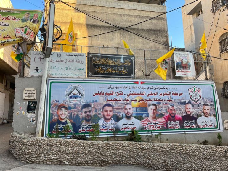 A poster on a wall depicting men killed by Israel