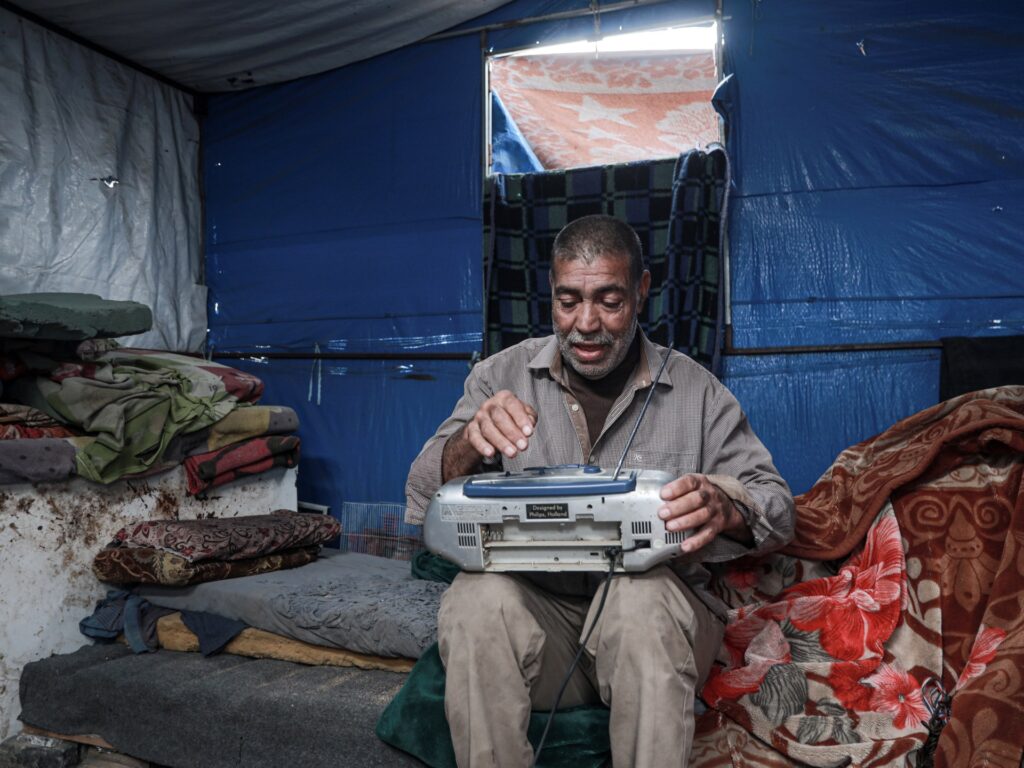 Palestinians in Gaza worry and wait for Israel to implement ceasefire Palestinians in Gaza worry and wait for Israel to implement ceasefire