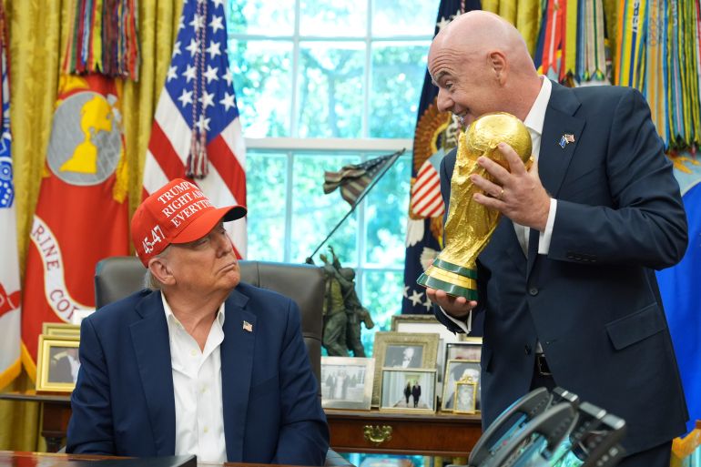 Gianni Infantino and Donald Trump react.