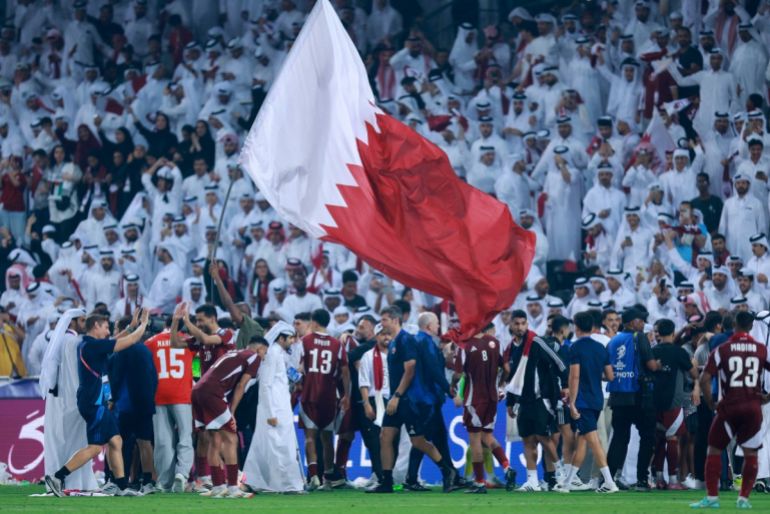 Qatar's players celebrate after the FIFA World Cup 2026 Asian qualifier football match between Qatar and the UAE at Jassim Bin Hamad Stadium
