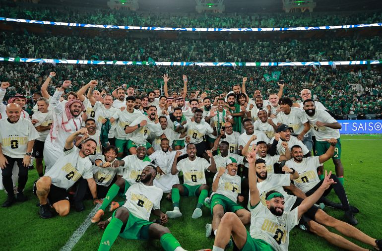 audi Arabia players celebrate after qualifying for the FIFA World Cup following their win against Iraq