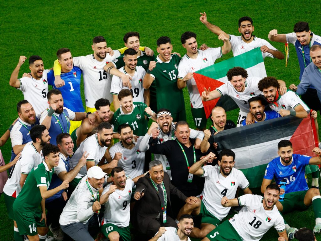 Gritty Palestine enter Arab Cup quarters as favourites Qatar crash out