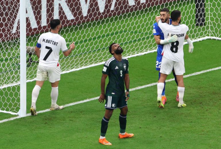 Saudi Arabia's Firas Al Buraikan, Palestine's Hamed Hamdan, Palestine's Ikram Rami Hamadeh and Palestine's Musab Al Battat react