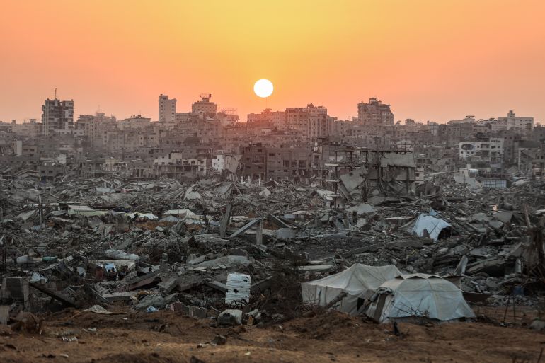 The sun sets over a heavily damaged area of Jabalia.