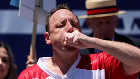 Reuters Joey Chestnut participates in the 2026 Nathan's Famous International Hot Dog Eating Contest, at Coney Island, Brooklyn in New York City on July 4. 