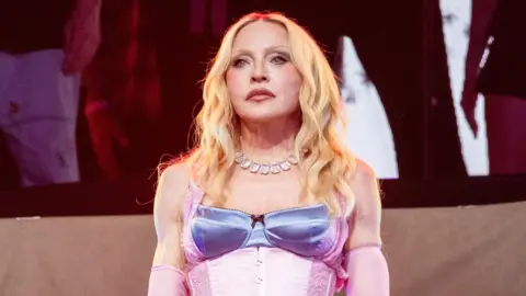 Getty Images Madonna is seen performing a surprise concert in Times Square on June 04, 2026 in New York City.