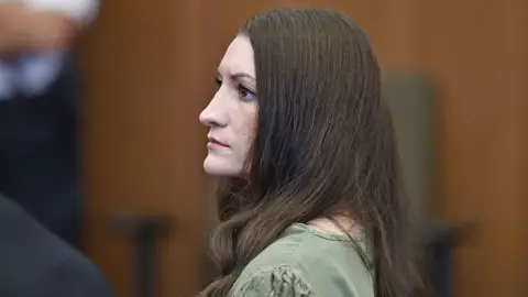 AFP via Getty Images Lindsay Clancy looks on as jurors (out of frame) enter the courtroom during Clancy's murder trial at the Plymouth County Superior Court in Plymouth, Massachusetts, on September 4, 2026. 
