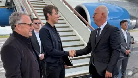 Reuters Steve Witkoff (left) next to Jared Kushner (centre) as they are greeted by Russia's Kirill Dmitriev