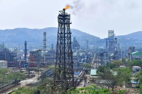 AFP via Getty Images A general view of the Guwahati refinery operated by Indian Oil Corporation is pictured in Guwahati on March 30, 2023. On March 29 Russian oil giant Rosneft announced a deal with Indian Oil to substantially increase oil supplies to the firm. India has emerged as a major buyer of Russian oil since the Ukraine war. (Photo by Biju BORO / AFP via Getty Images)