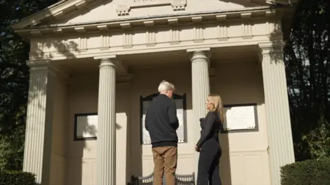 Earl Spencer talking with Laura Kuenssberg at Diana's burial site on the  Althorp estate 