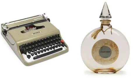 Millon A composite image showing a grey Olivetti typewriter and a glass round bottle of L'Heure Bleue by Guerlain, which is stained