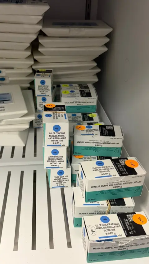 Dale Weiser Boxes of MMR vaccines