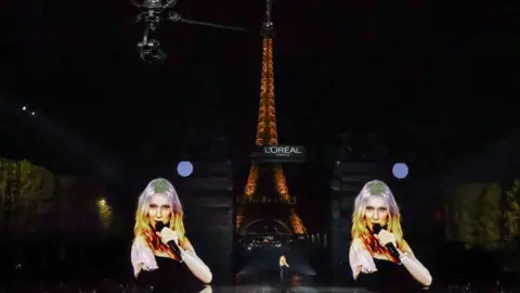 Getty Images Celine Dion belted out her 2002 hit on the L'Oreal catwalk in front of the Eiffel Tower