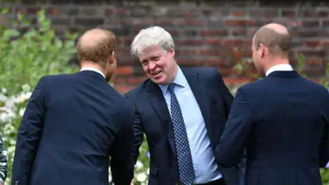 Getty Images Earl Spencer shaking the hand of his nephew Prince Harry with Prince William beside him