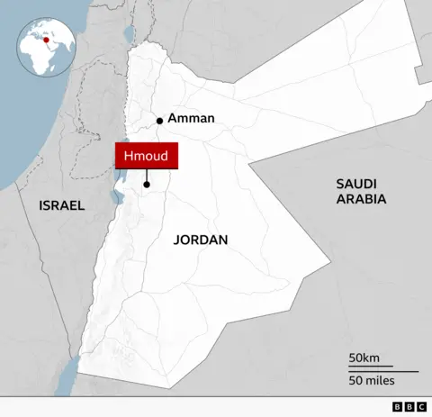 Map of Jordan showing the location of Hmoud in the west-central part of the country, south-west of Amman and near the Dead Sea. 

Neighbouring countries Israel and Saudi Arabia are labelled, with a locator globe showing Jordan’s position in the Middle East.
