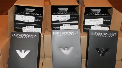 HMRC There are boxes of fake Emporio Armani-branded underwear.