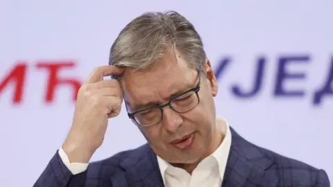 EPA/Shutterstock Serbian Progressive Party (SNS) prime ministerial candidate Aleksandar Vucic reacts after conceding defeat during a press conference at the party headquarters in Belgrade, Serbia, 25 October 2026. Roughly 6.5 million eligible voters were called to the polls in a snap parliamentary election to choose lawmakers for a four-year term.