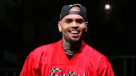 Getty Images Chris Brown performs during Tycoon Music Festival at State Farm Arena on February 13, 2024 in Atlanta, Georgia