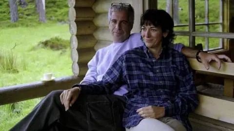 US Department of Justice Epstein and Maxwell pictured sitting on a bench side by side
