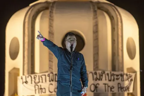 Getty Images Arnon Nampa speaks to the protesters during a demonstration in 2023.