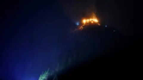 Reuters The Eagle's Nest on fire in the dark
