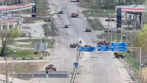 Reuters/Handout  A still image taken from an undated drone video released September 24, 2026, shows destroyed vehicles sitting on a street in Oleshky, Kherson Region, Russian-controlled Ukraine.