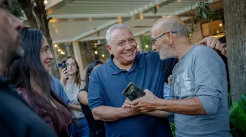 Getty Images Eisenkot shakes a mans hand. 