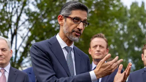 EPA Google CEO Sundar Pichai gesturing with his hands while speaking to reporters outside of the White House.