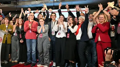 AFP via Getty Images Members of the Student List celebrate victory in Serbia's parliamentary election