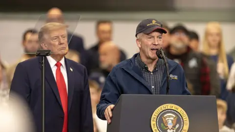 Getty Images Dan Sullivan and President Trump at a rally in Alaska. 