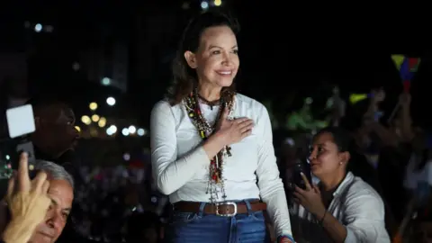 Reuters Venezuelan opposition leader Maria Corina Machado greets supporters as she arrives in Caracas 